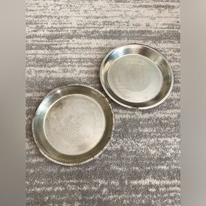 2 large vintage pie tins 11”, 1 NYAC winged foot and 1 blank